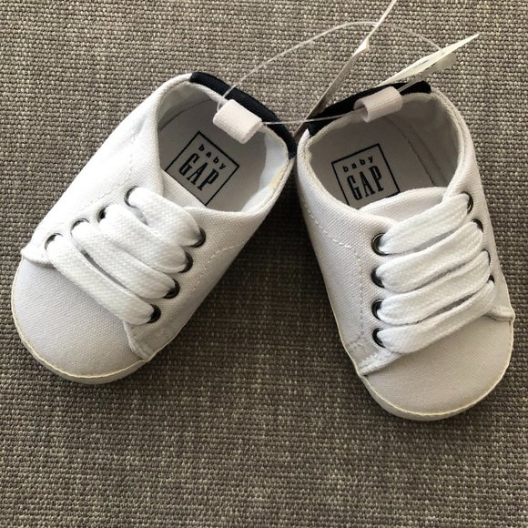 white canvas baby shoes